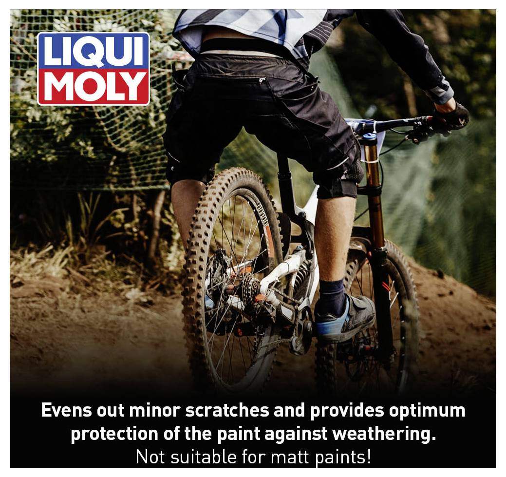 A mountain biker rides downhill, surrounded by trees. Top left, the 'LIQUI MOLY' logo. Bottom text: 'Protects paintwork optimally, not suitable for matte paint finishes'.