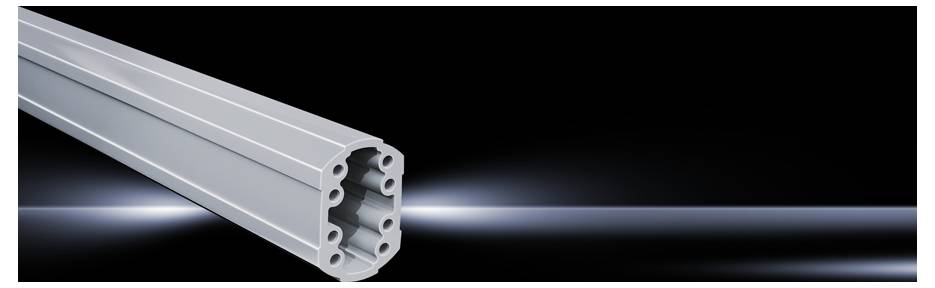 A silver metal profile with multiple holes, lying horizontally on a black background. Illuminated edges emphasise the shape.