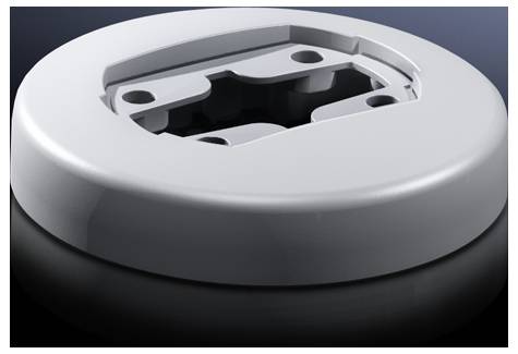 Round, silvery metal attachment with openings, likely part of a technical device or mounting bracket on a black background.