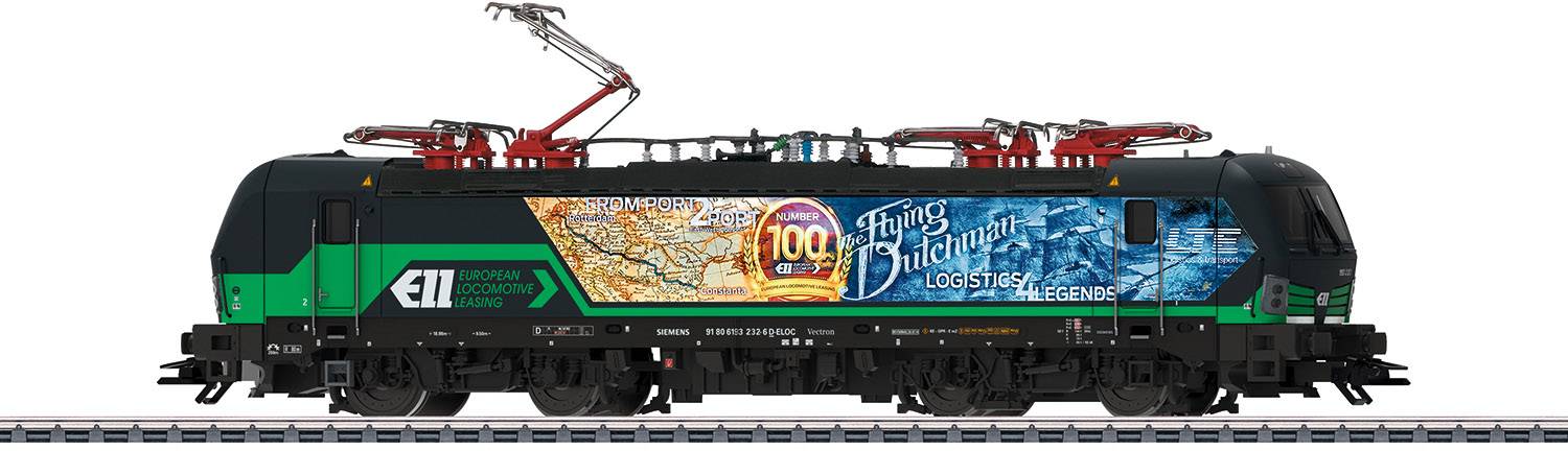 A modern electric locomotive travels on railway tracks. It is colourfully decorated with advertising motifs and bears the inscription 'Klaus' and 'Logistics'.