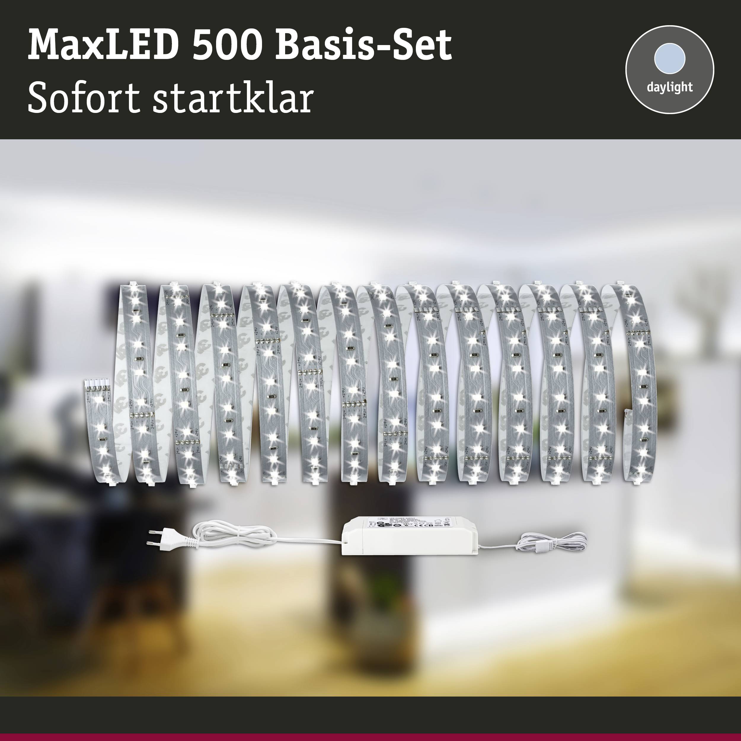 'MaxLED 500 Base Set' LED light strip with control unit, ready to use immediately. Blurred interior in the background.