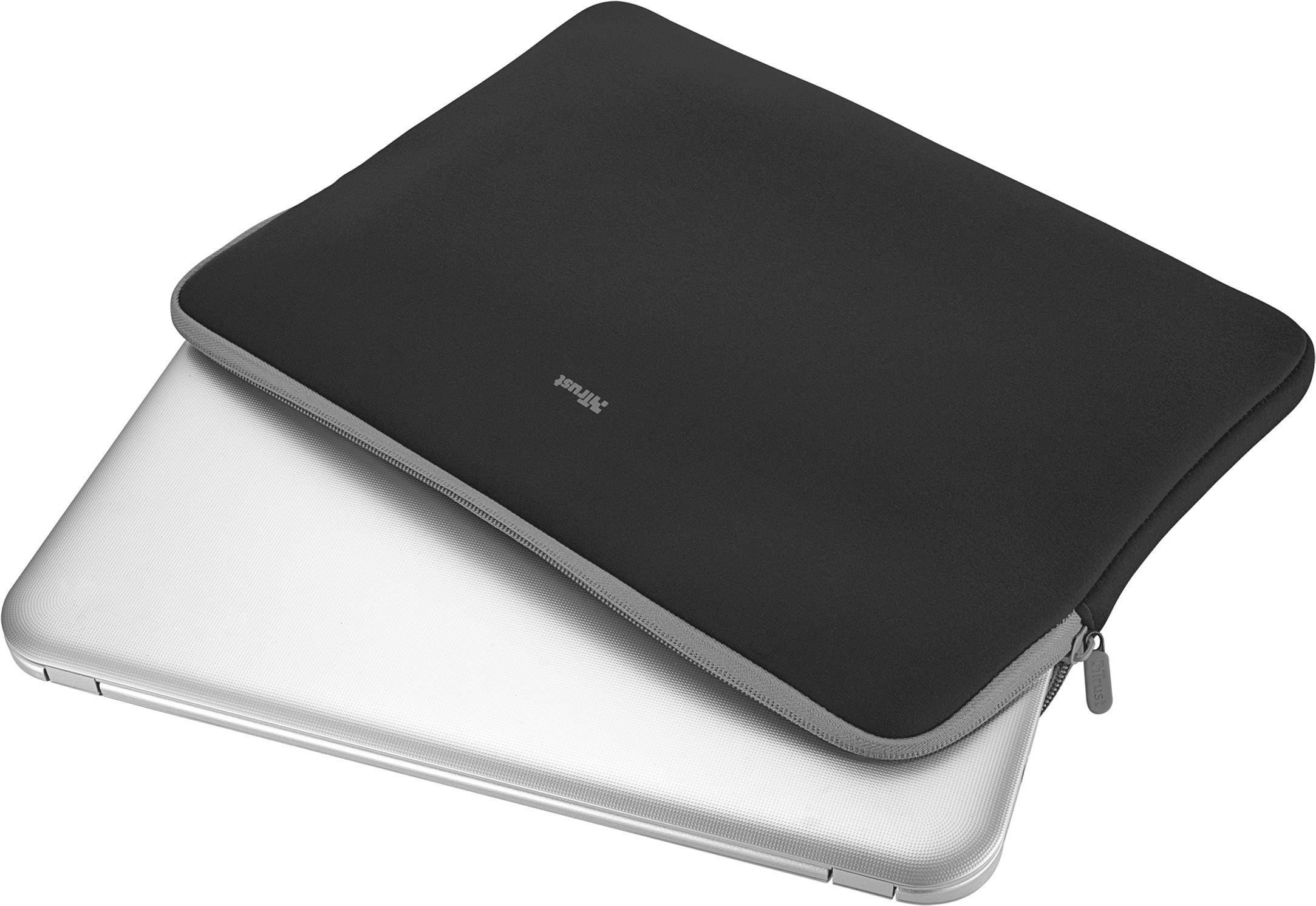 A closed silver laptop partially protrudes from a black laptop sleeve resting on a table.