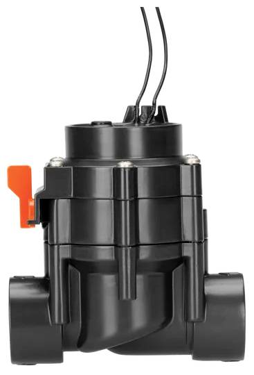 A black irrigation valve with three wires on top and an orange switch on the side.
