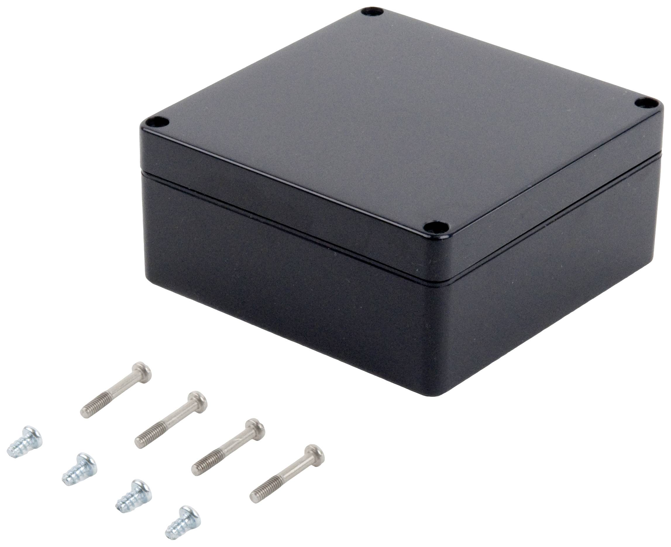 Black, rectangular housing with rounded corners, alongside six metal screws in two different sizes.