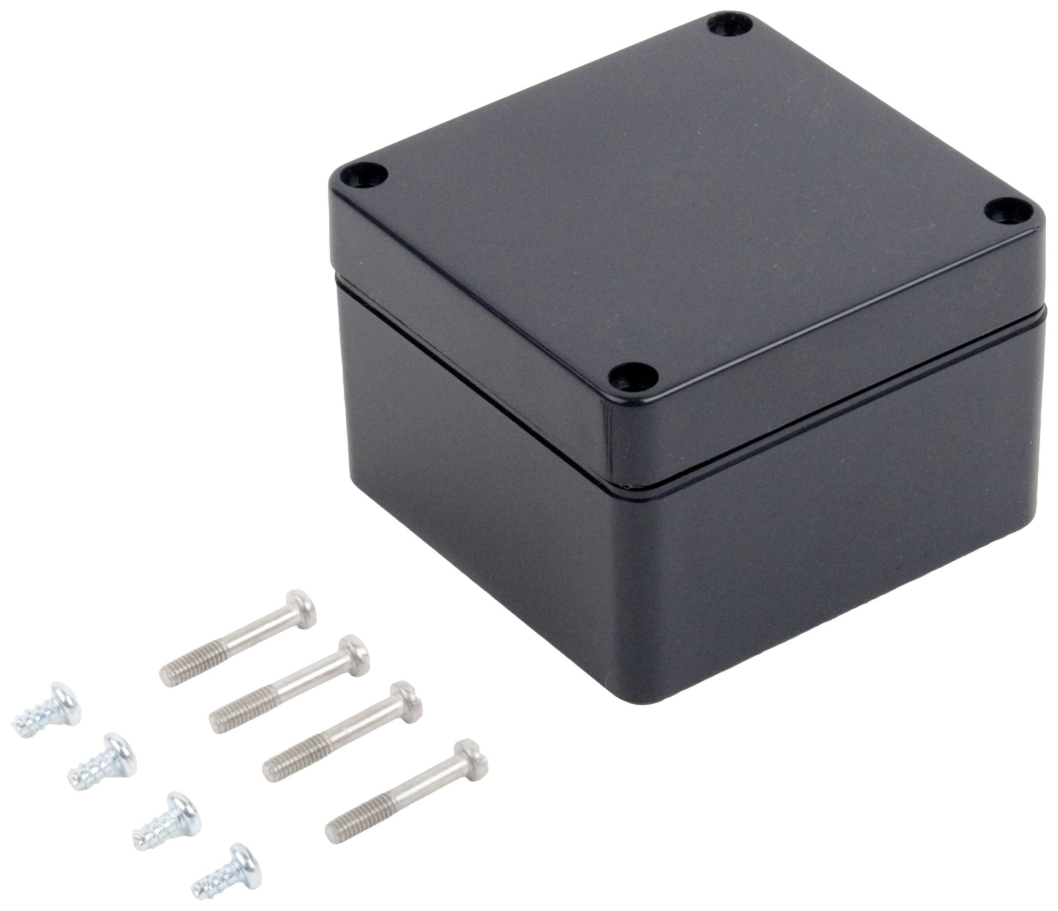 Black rectangular housing with four screw holes at the corners, alongside six metal screws in two different sizes.