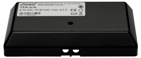A black electronic device called TSA-a/b with technical details on a label, including voltage 8-12 VAC, 10-40 VDC, max. 0.5 A.
