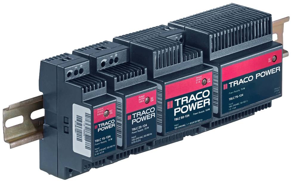 Four black Traco Power modules mounted on a metal rail, each with red and white labelling, for power supply.