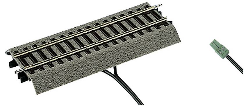 Spur gauge system with a brown track section and a connected green adapter plug for model railways.