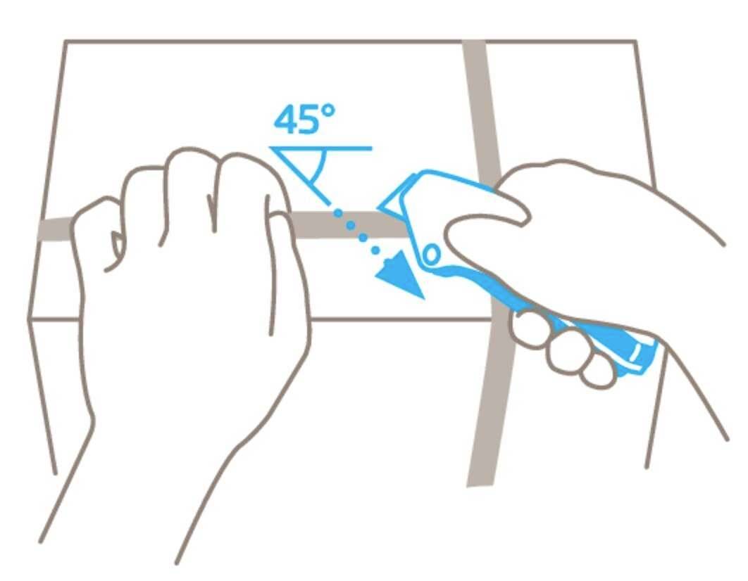 A hand holds a craft knife and demonstrates how to cut parcel tape safely at a 45-degree angle.