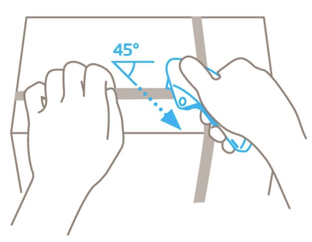A hand holds a package, while the other cuts the tape with a knife at a 45-degree angle.