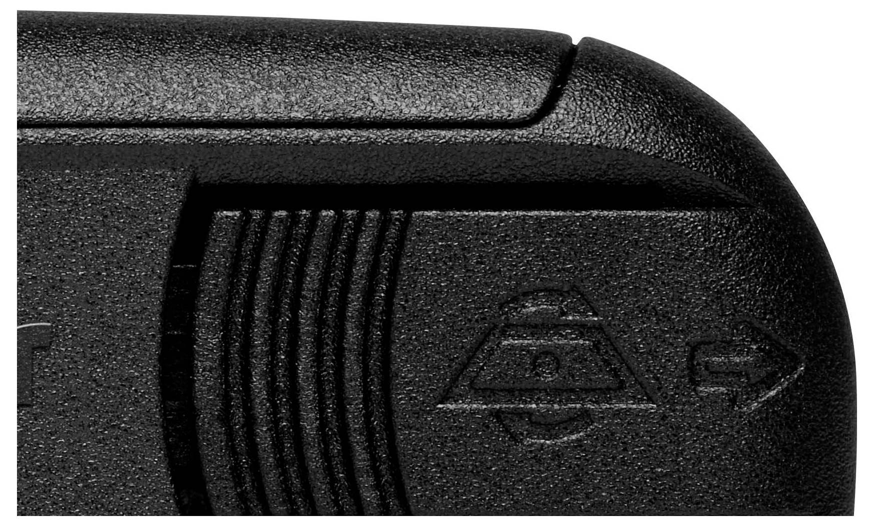Close-up of a black plastic device with a non-slip surface and embossed symbols.