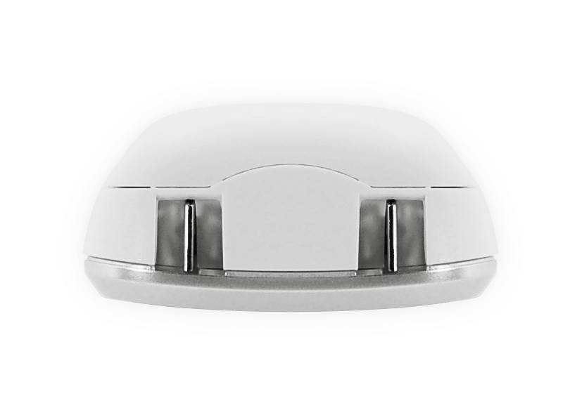 A white, rounded object with two metal springs on its underside, possibly an electronic device.