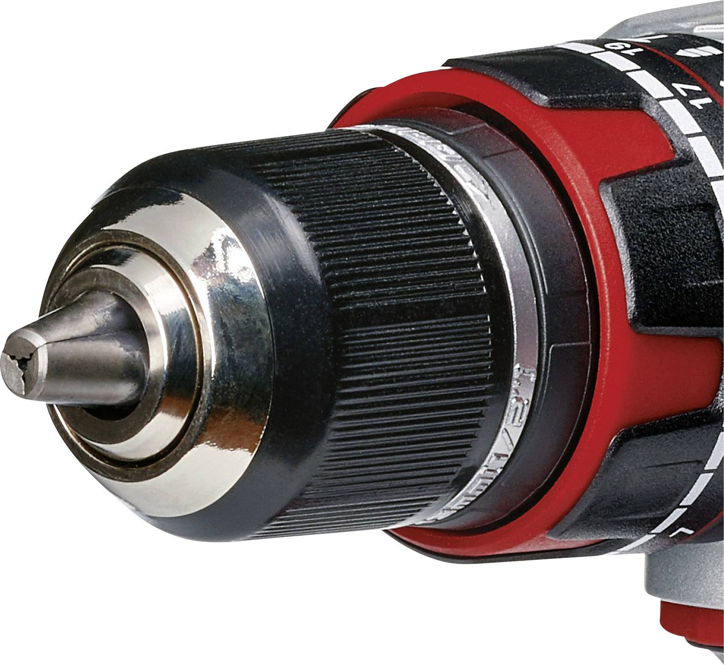 Close-up of an electric drill with a silver chuck, black handle, and red accents.