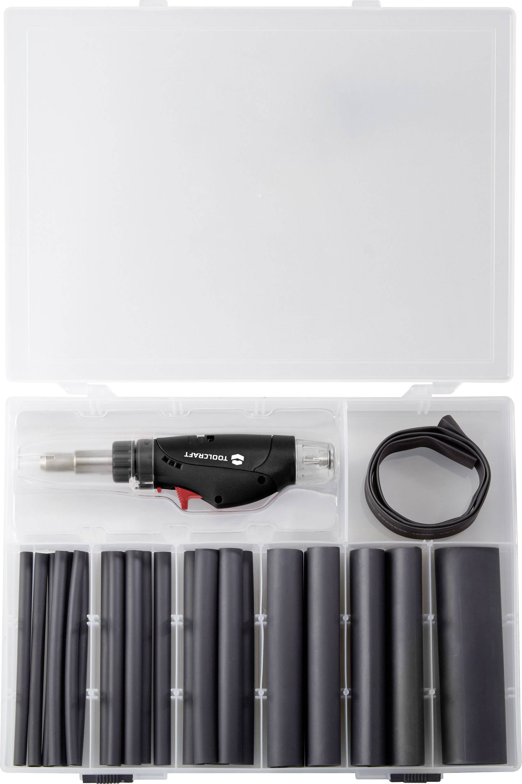 A set with an electric tool in a case, surrounded by several black heat-shrink tubes and a rolled-up tape.