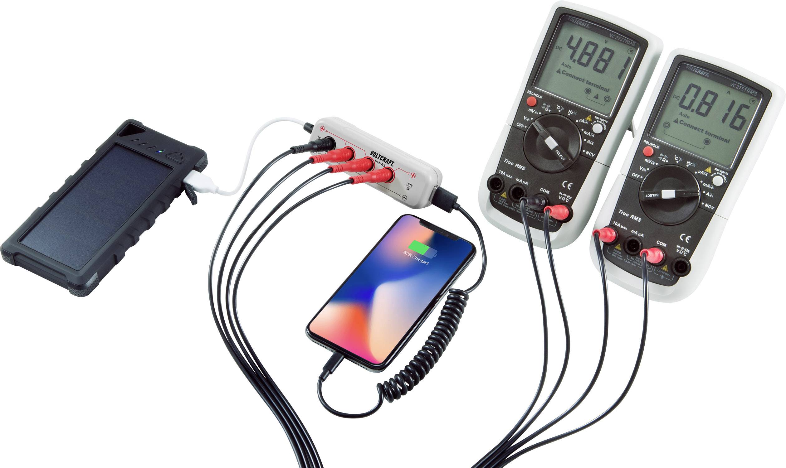 Smartphone being charged by solar charger, connected to two multimeters. Display: 4.88 V and 0.16 A. Energy measurement scenario.