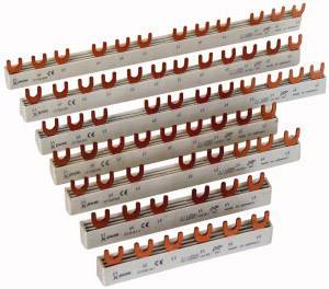 Several copper busbars with orange clips, numbered and marked for testing, for use in electrical control cabinets.