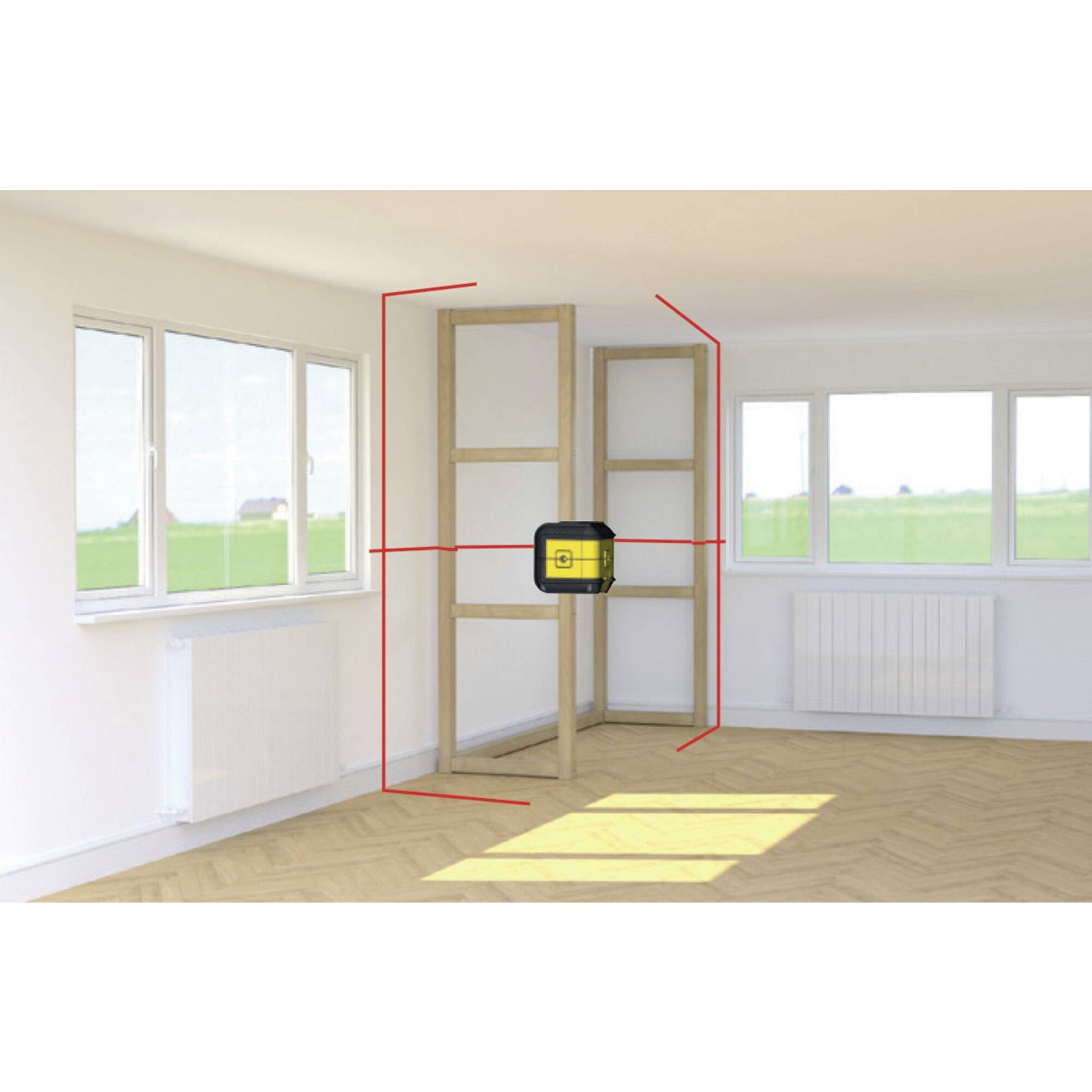 A room with a wooden shelving unit in the corner. A yellow laser measuring device is mounted on the wall, projecting red lines for alignment.