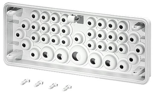White plastic plate with various openings for cable entry, accompanied by three separate cable ties underneath.