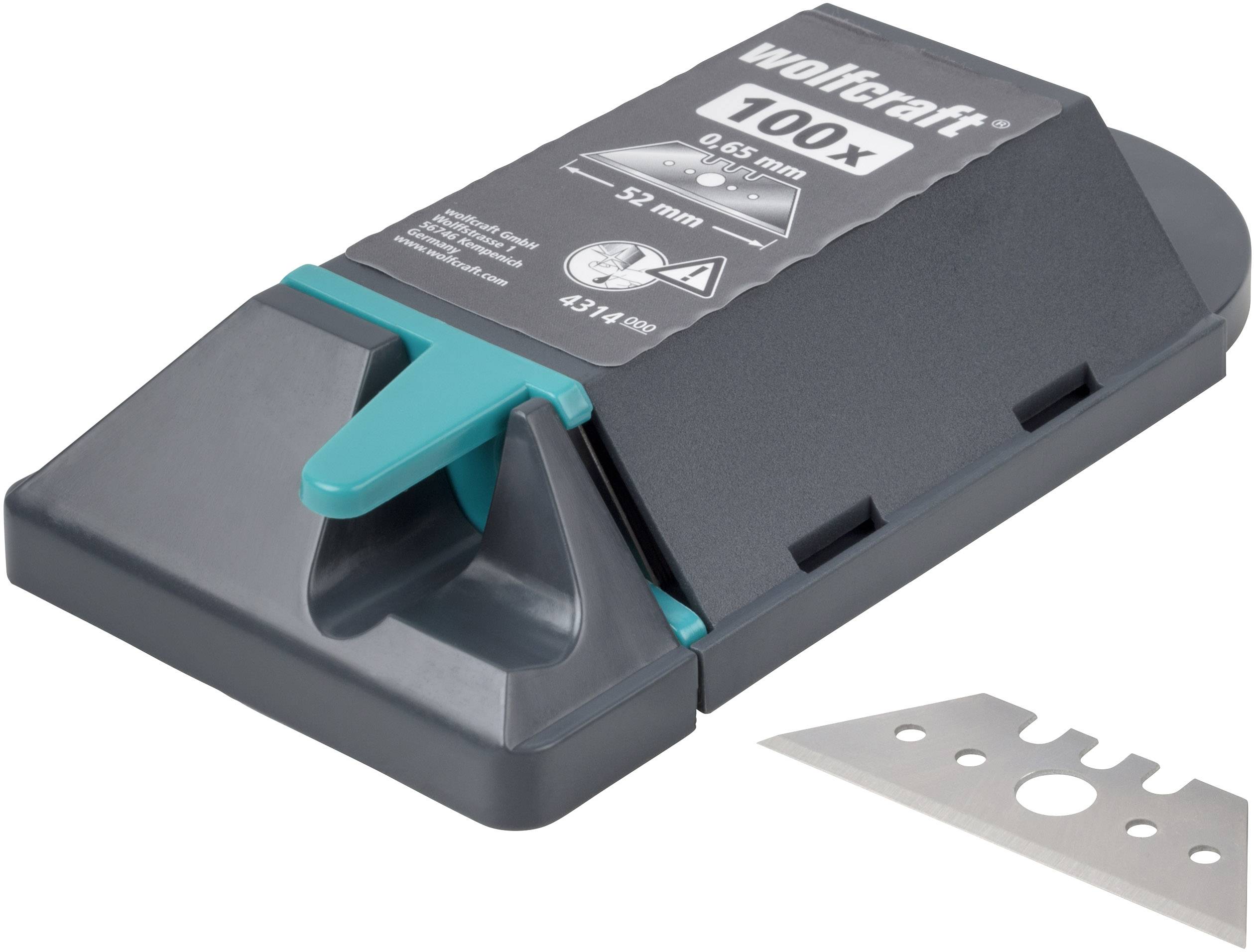 Cutting tool with green blade and spare blade. Packaging: 'wolfcraft 100x, 0.65 mm, 52 mm'. Ideal for cutting various materials.