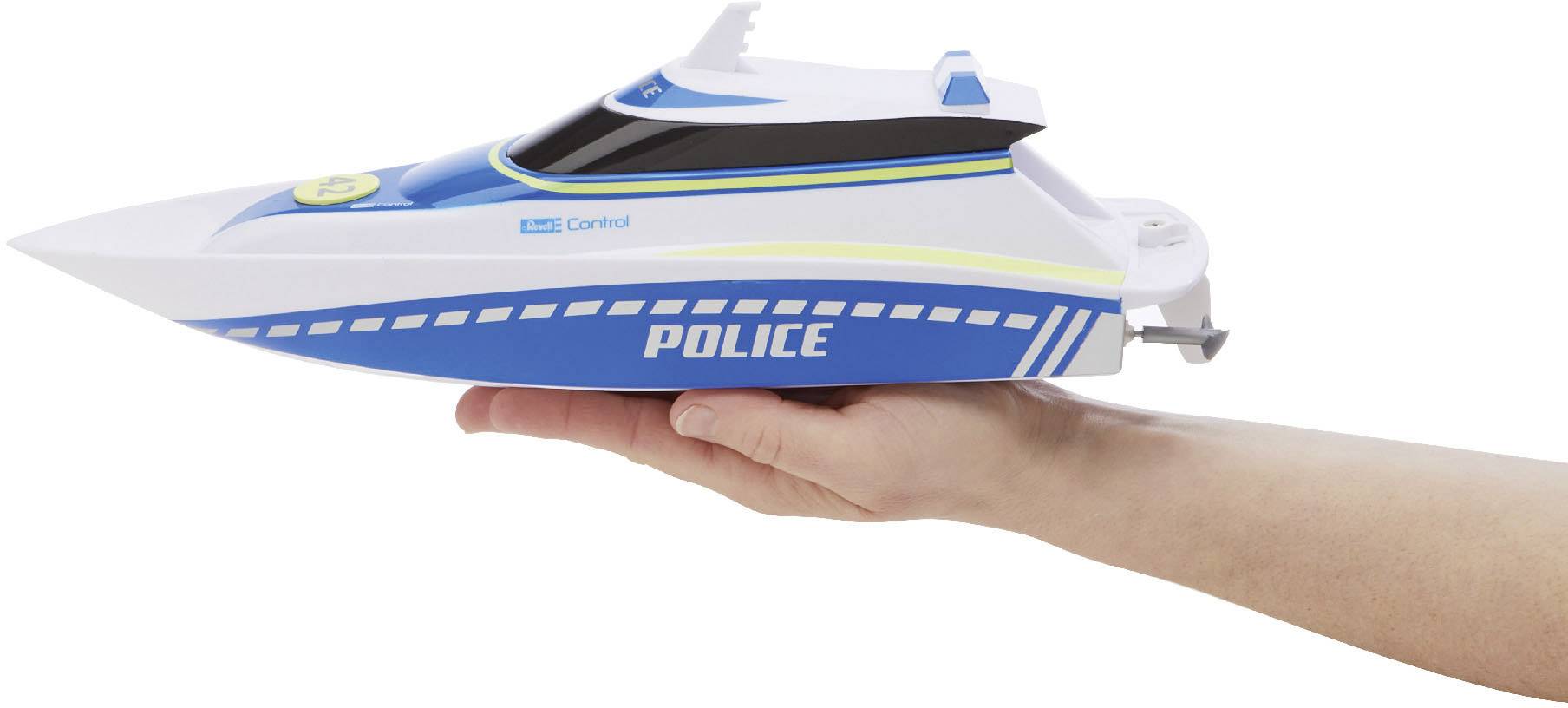 A model boat in blue and white colours with the inscription 'POLICE' is being held by a hand. It has distinctive yellow and black stripes.