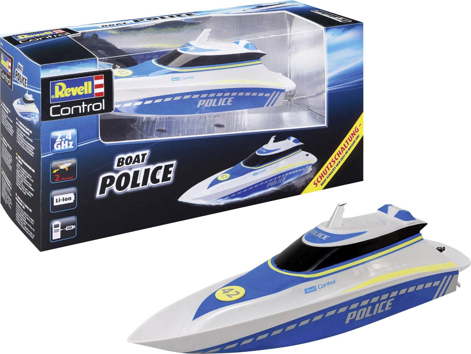 A model of a blue police boat in packaging labelled 'Revell Control'. The boat has white details and yellow stripes.