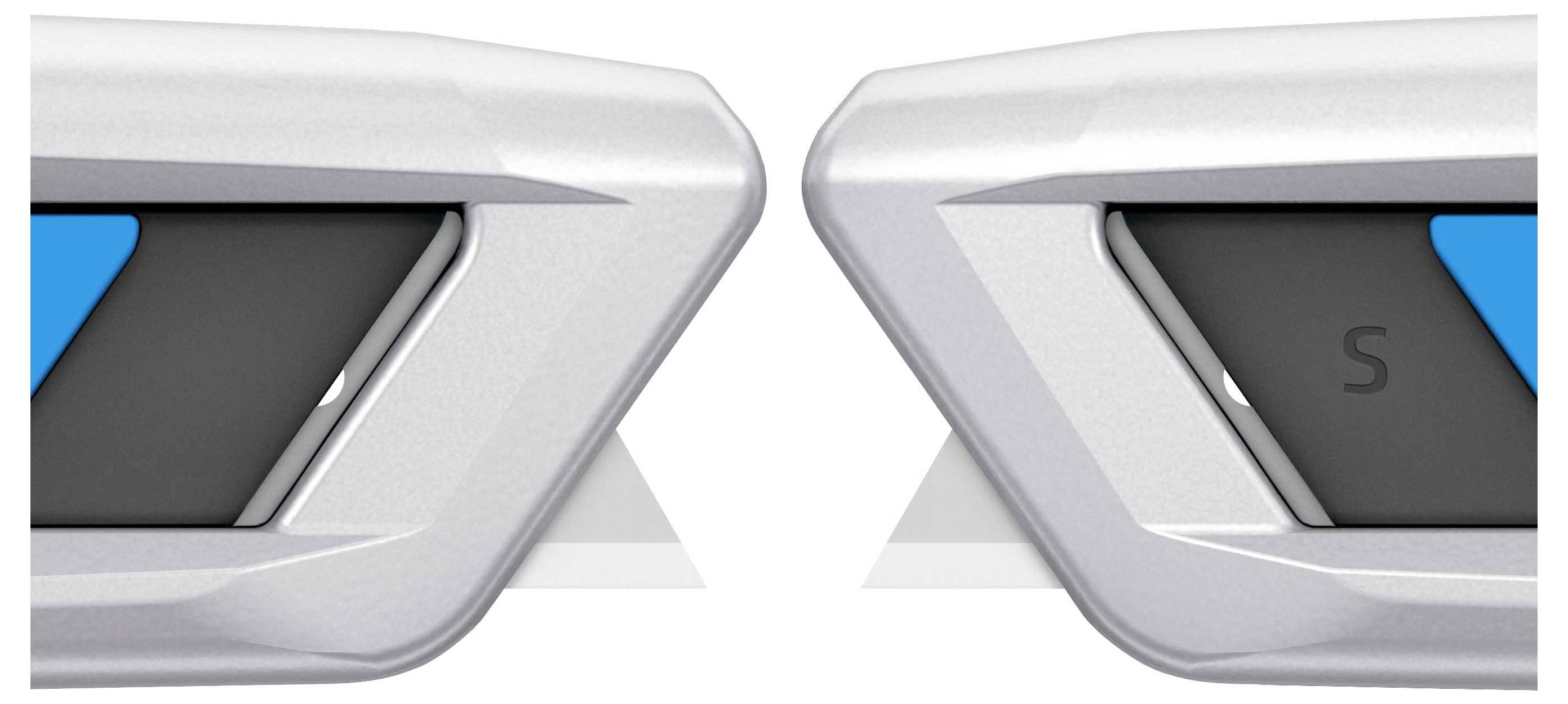 Silver decorative elements with black and blue details pointing towards each other. On the left is a blue triangle, on the right an 'S'.