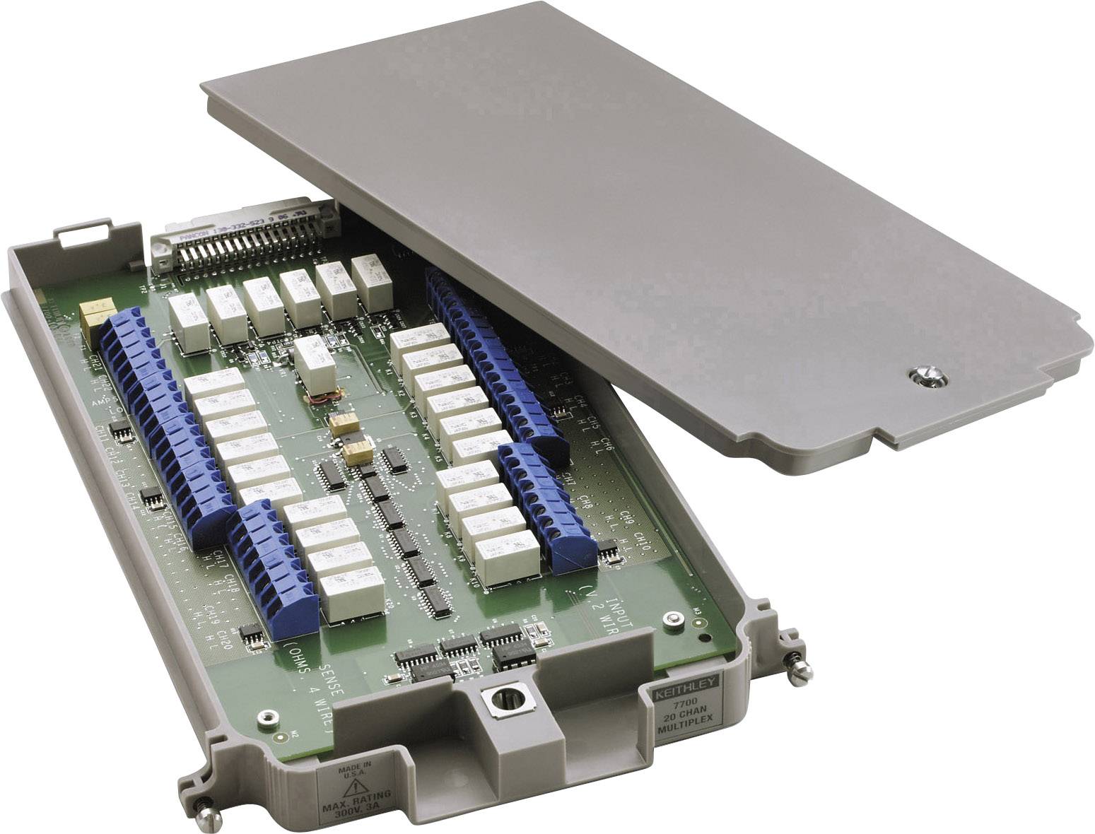 Opened electronic control unit with visible circuit boards and connection strips in a grey housing.