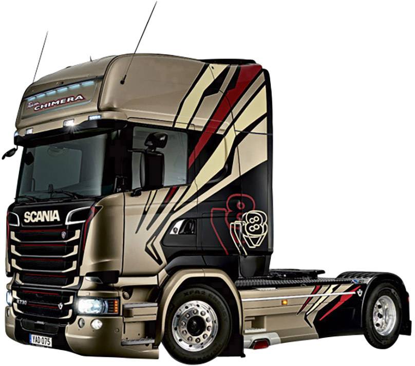 A brown Scania lorry with distinctive graphic patterns on its side is positioned sideways in the image.