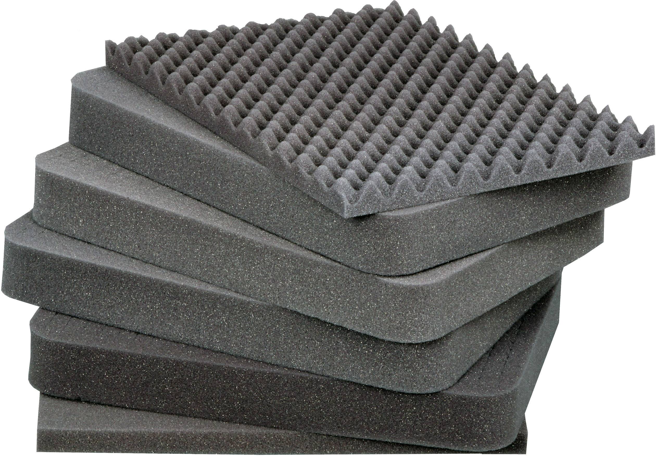Six stacked foam panels, topped with a pyramidal structure, for sound insulation.