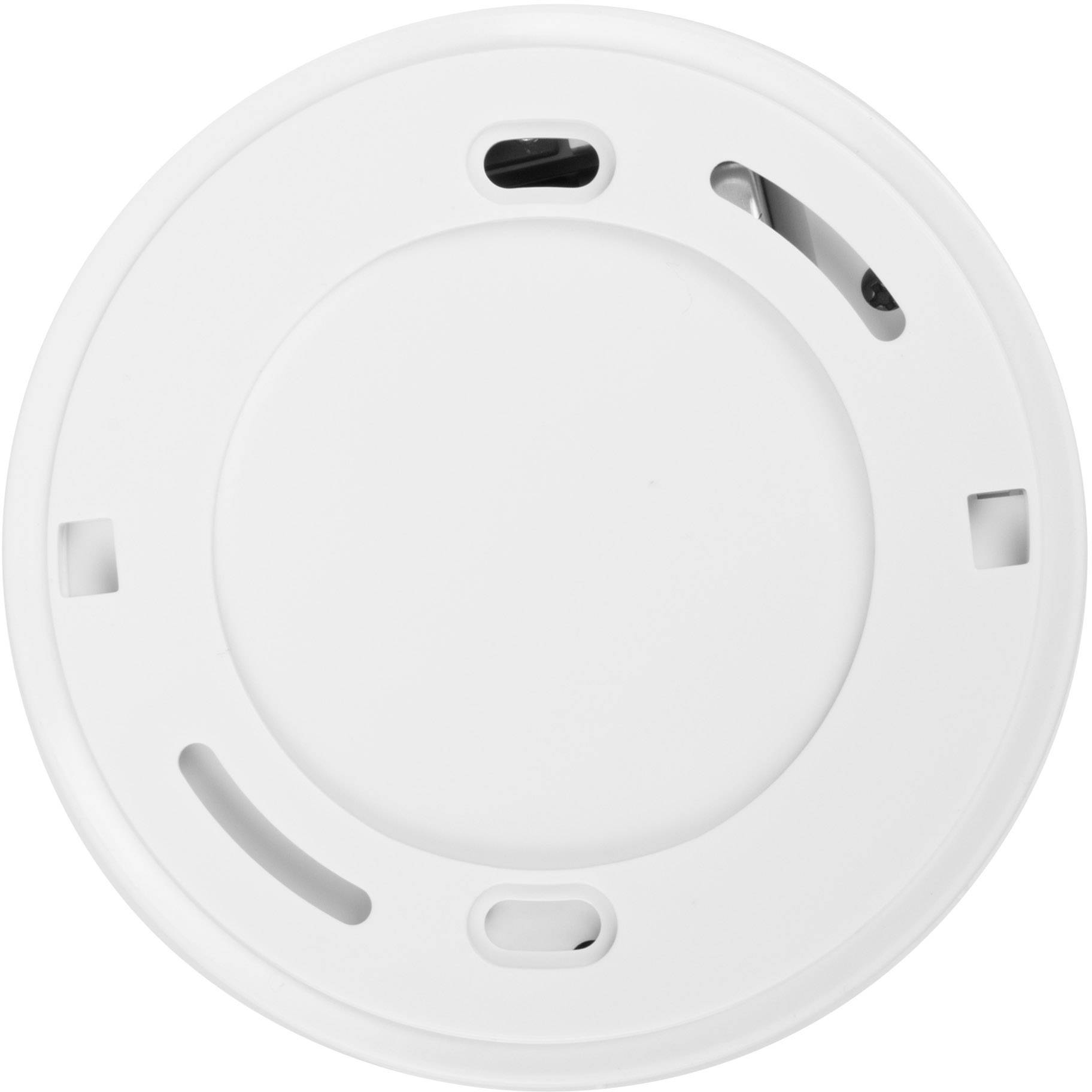 Round, white smoke detector mounted on a ceiling, with visible sensor openings and a smooth surface.
