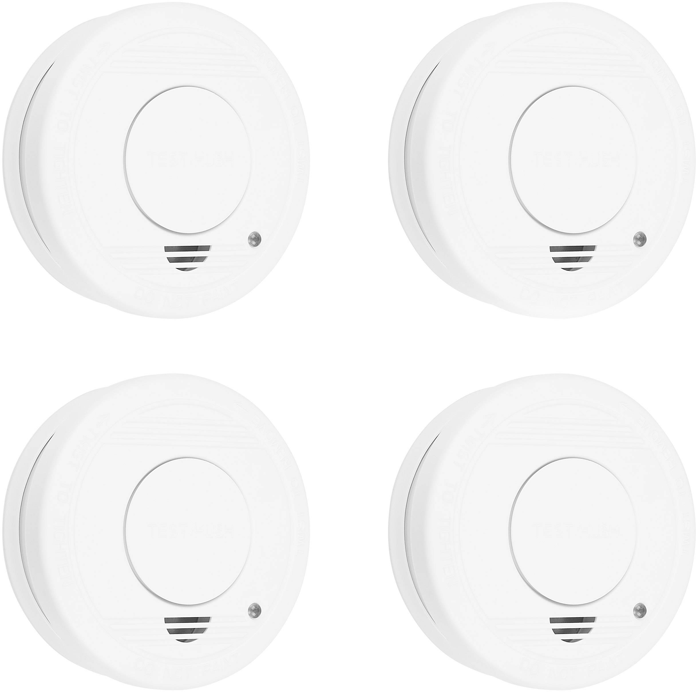 Four white smoke detectors arranged side by side. Each detector has a round shape with a small, dark point at the bottom.