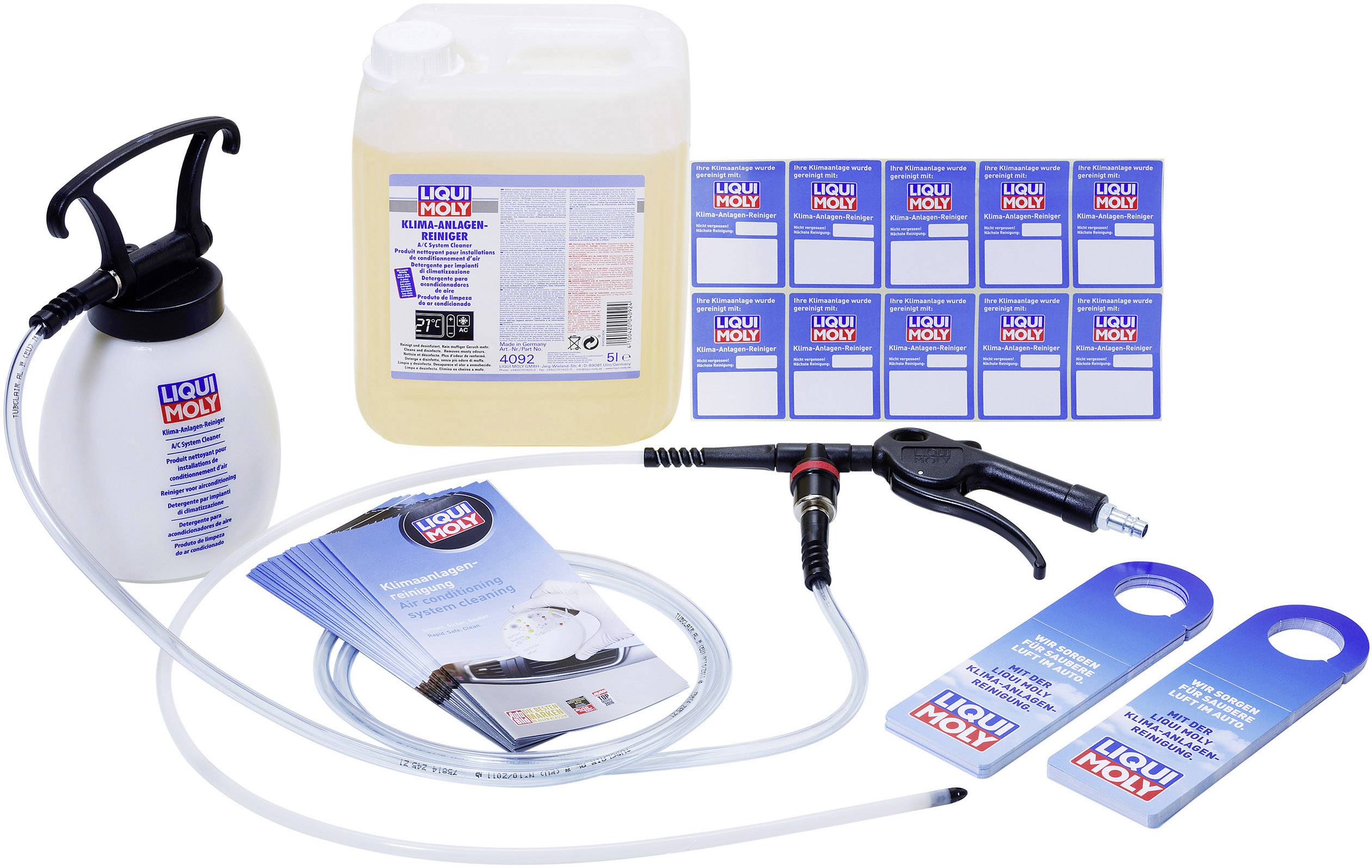Cleaning kit consisting of a liquid container, syringe, hose, labels, and information brochures by Liqui Moly.