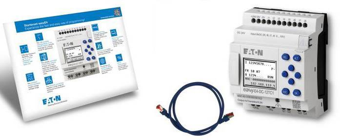 Eaton Programmable Logic Controller (PLC) with digital display, blue function key row and accompanying cable; instruction manual on the right.