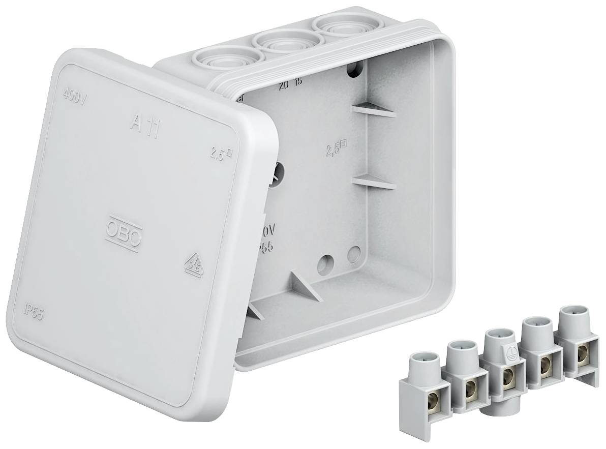 Grey electrical junction box with the lid removed, four round openings on top and five separate terminal points beside it.