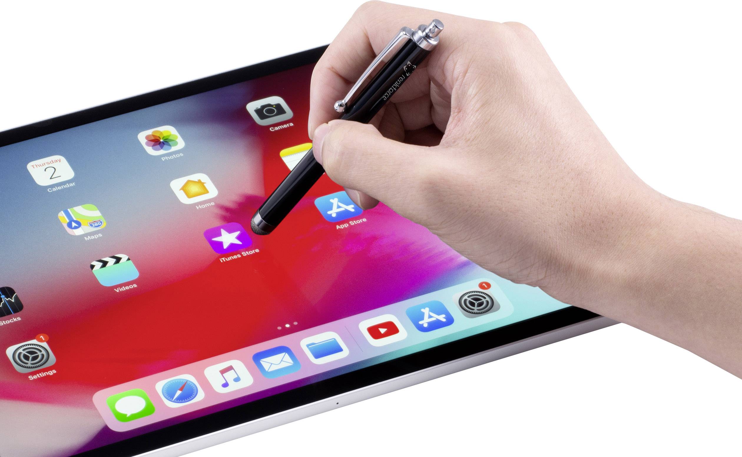 A hand holds a pen and taps on the display of a tablet, showing various app icons.