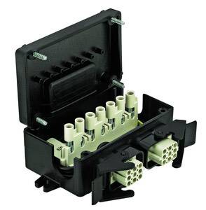 An open black electrical junction box with several white cable connections inside, revealing the internal wiring structure.