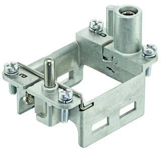 Metal component with multiple screws, a vertical cylinder, and lateral openings, likely part of a larger mechanism.