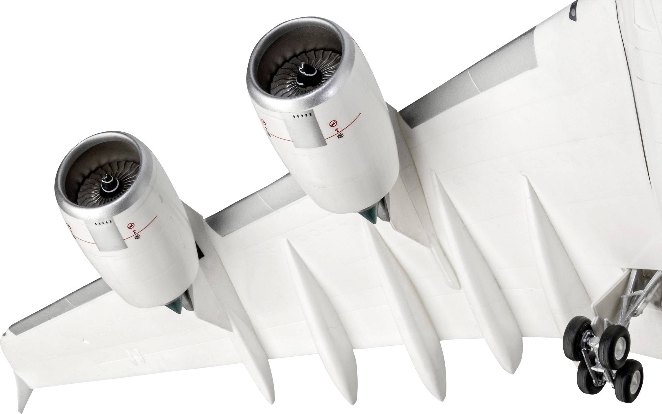 Two engines beneath an aircraft wing with landing gear visible.