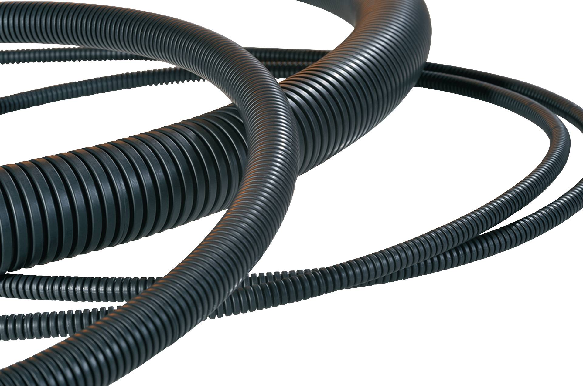 Several winding black plastic tubes in close-up demonstrate flexibility and structure.