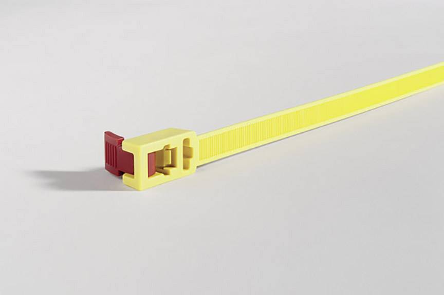 Yellow cable tie with a red closure on a grey background.