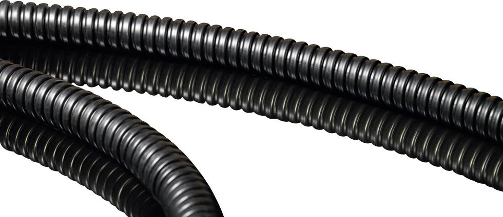 Black curved cables with a ribbed structure against a white background, reflecting on a smooth surface.