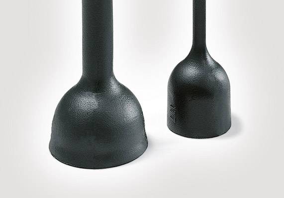 Two black rubber tools with handles, presumably plungers, stand upright side by side on a white surface.