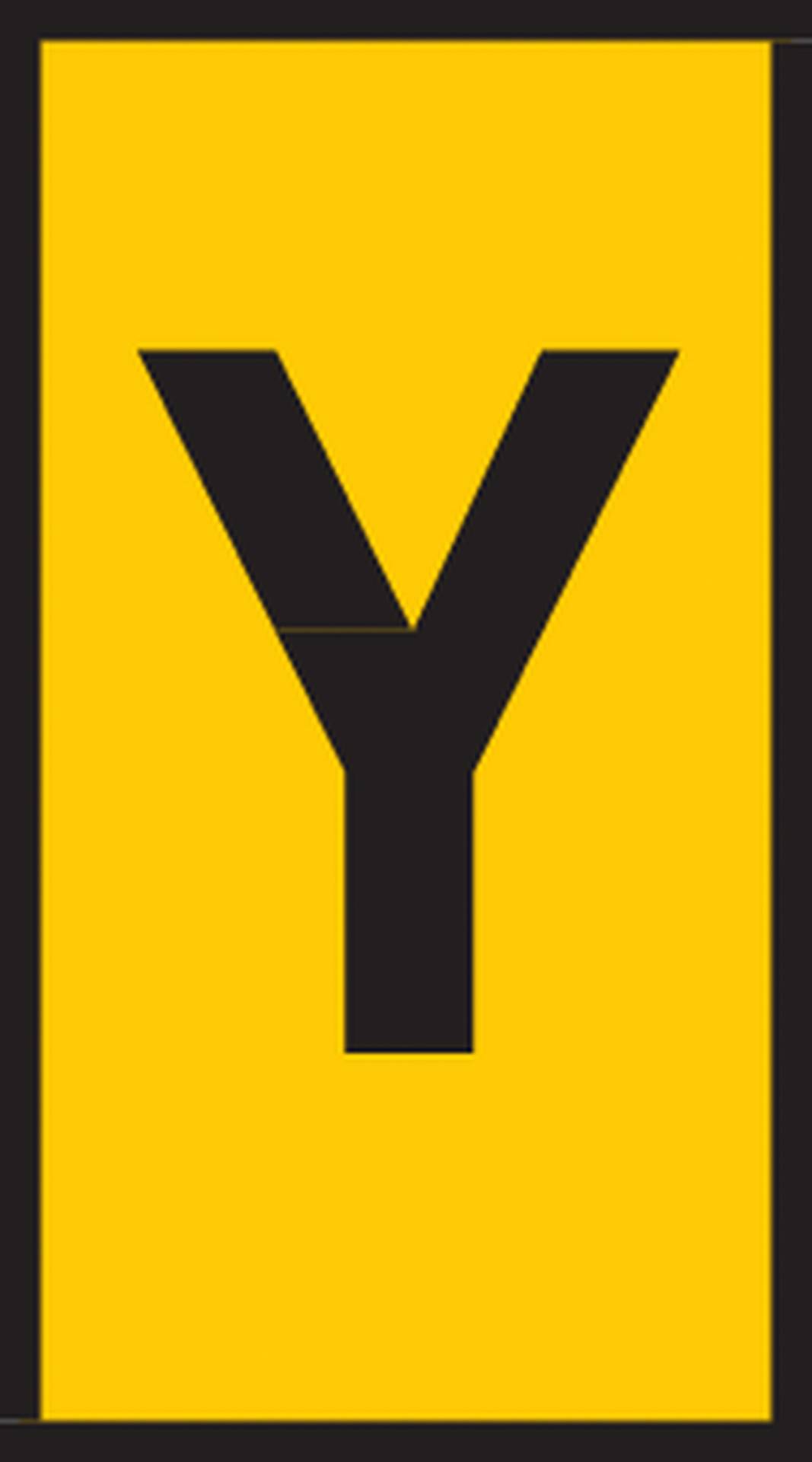 A yellow sign with a large, black letter 'Y' in the centre.