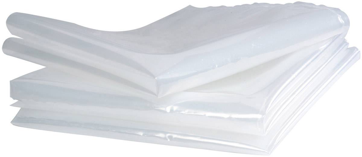 A stack of clear plastic sheets, neatly folded and layered, on a white surface.