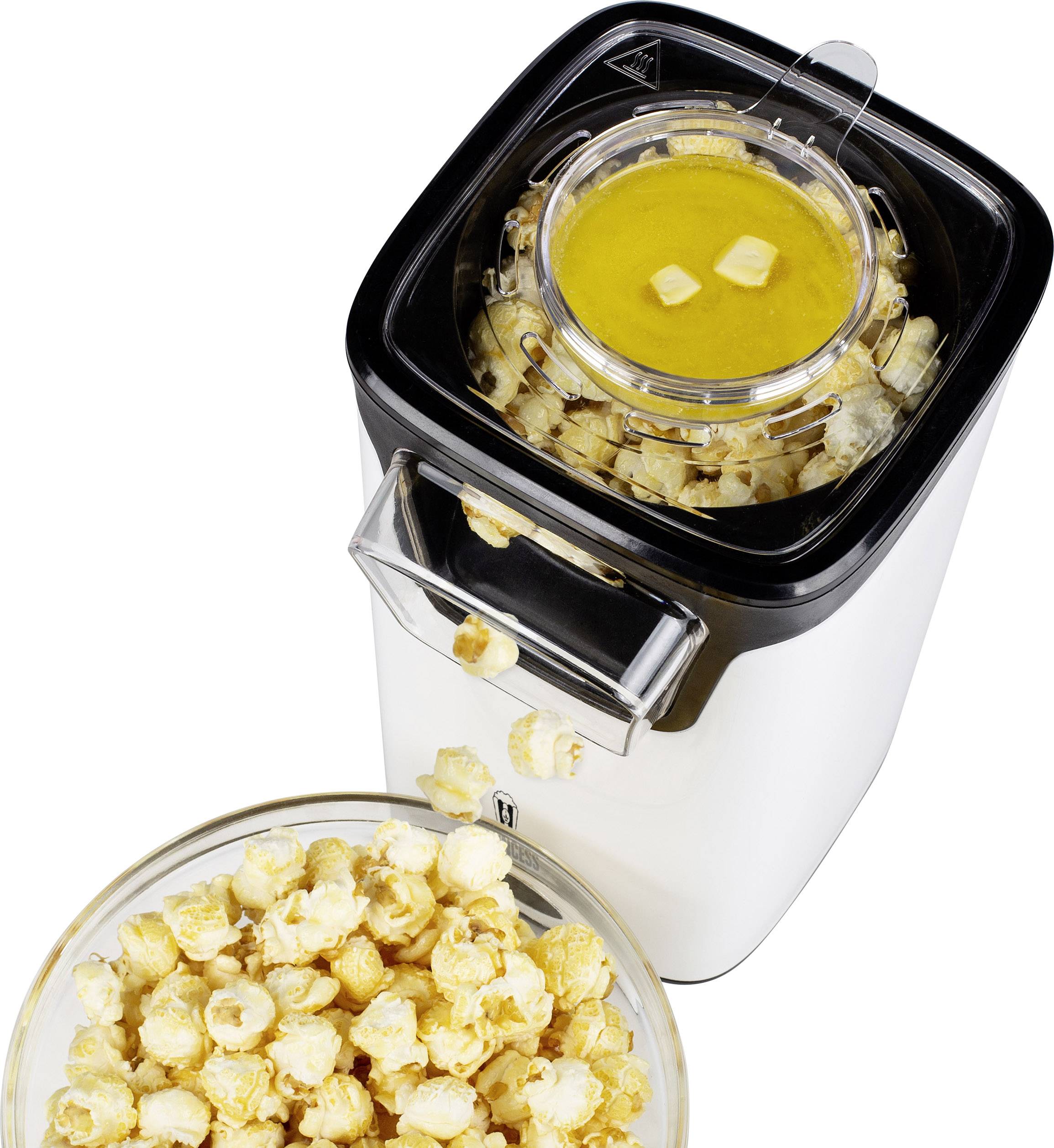 Popcorn machine with butter dispenser on top; bowl of freshly prepared popcorn in front of the machine.