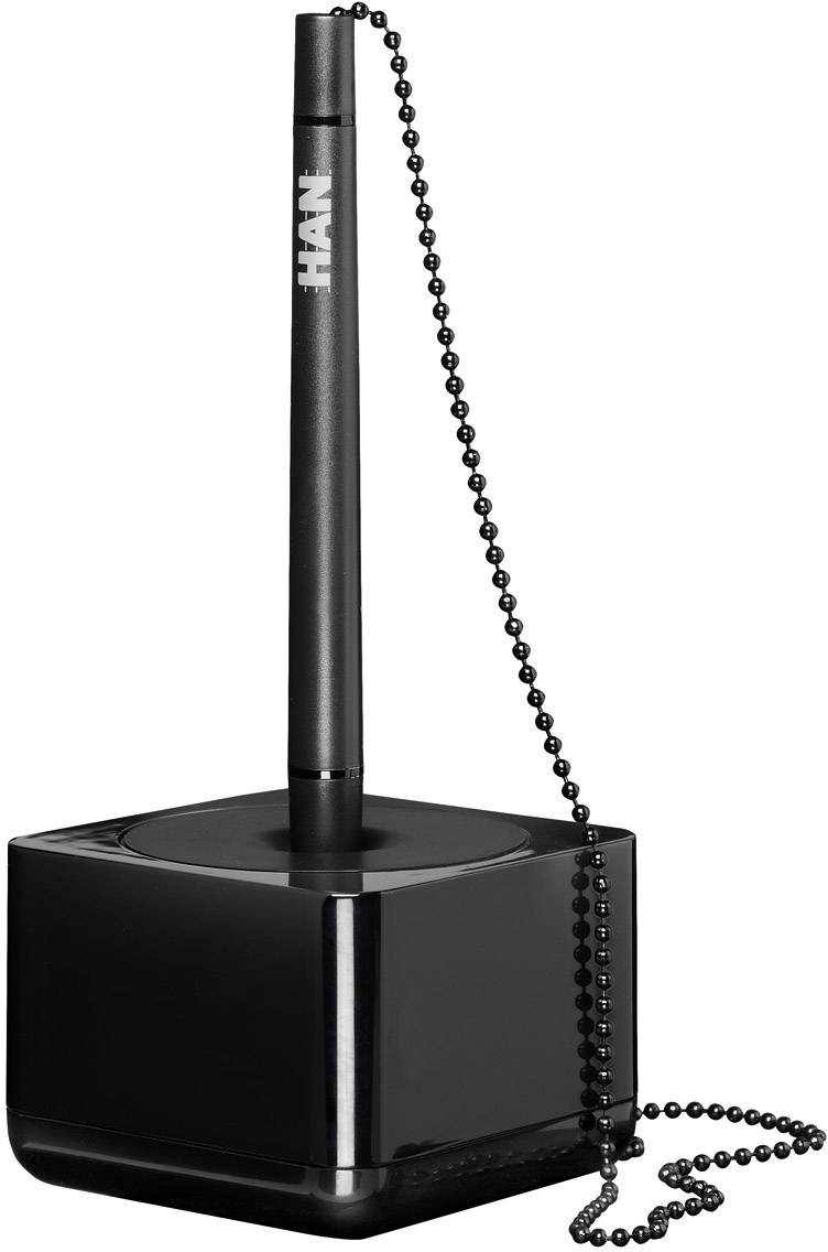 A black ballpoint pen with a chain stands vertically in a square stand.