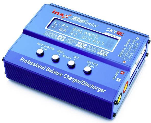 A blue 'iMAX B6 mini' charger displays 'LiPo BALANCE' on its screen. Connections and buttons are visible on the sides.
