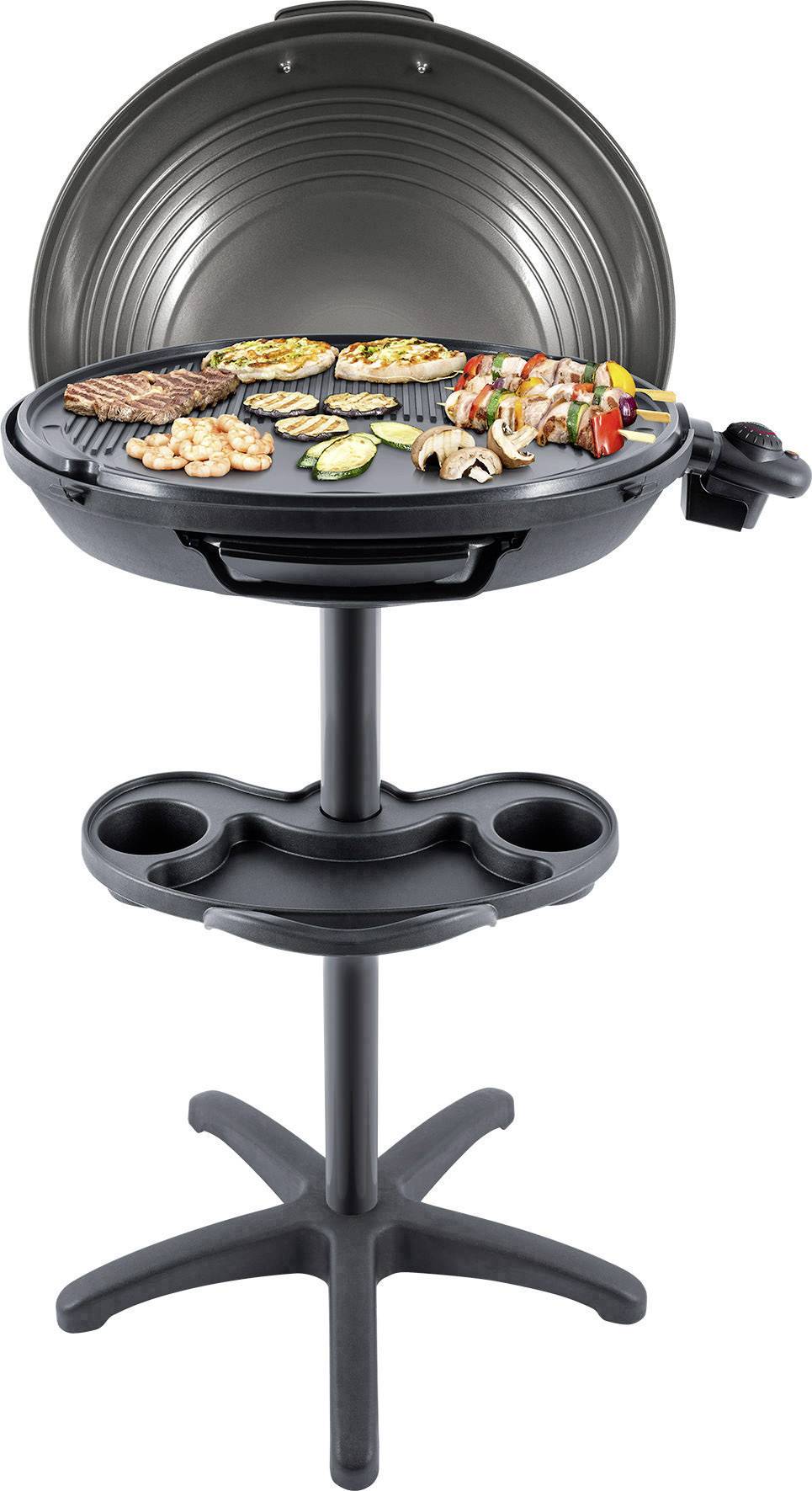 Electric countertop grill with a circular grilling rack, featuring various vegetables and prawns. The lid is open.