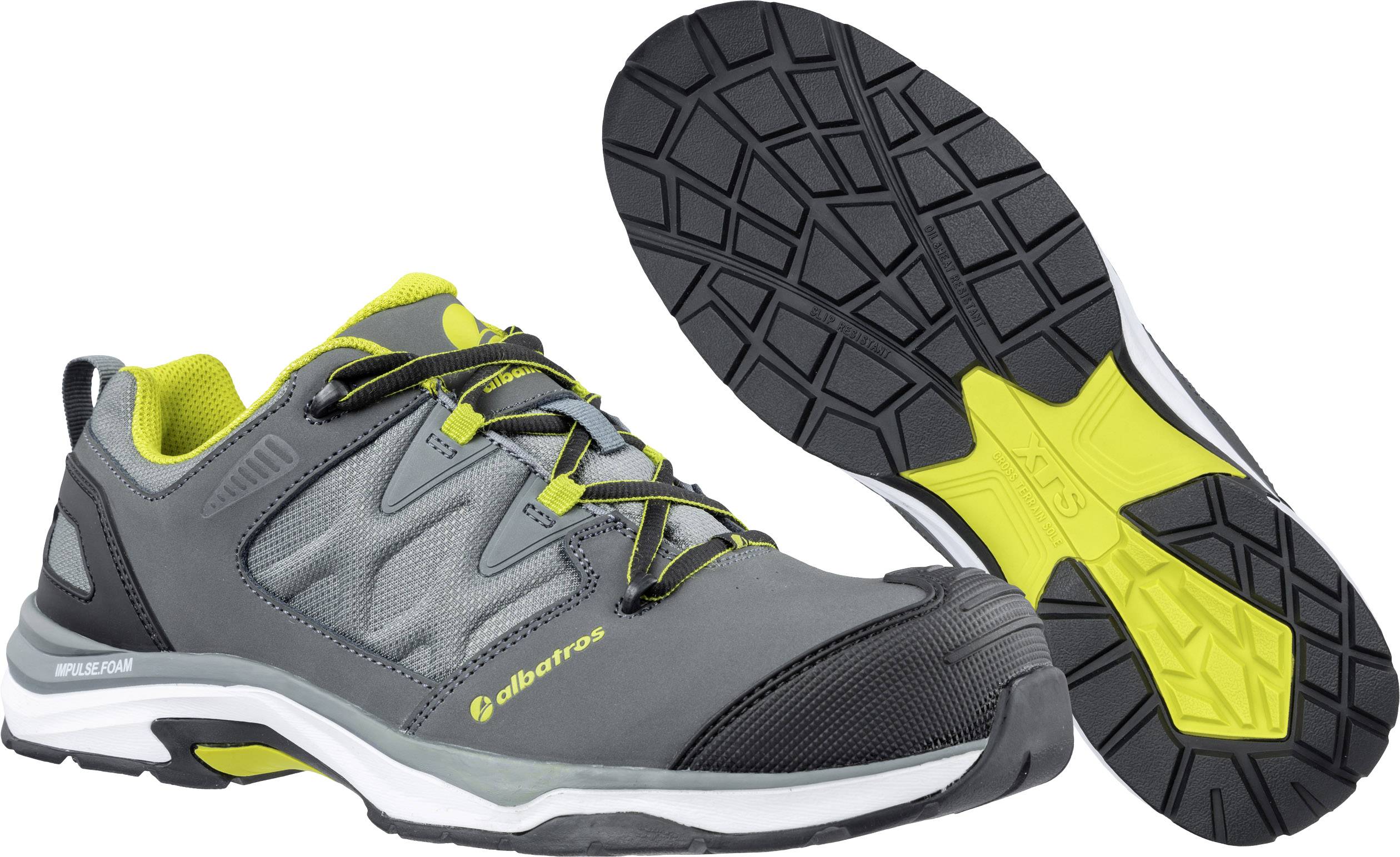 Grey and yellow sports shoe with non-slip sole and breathable material, side view and sole tread pattern.