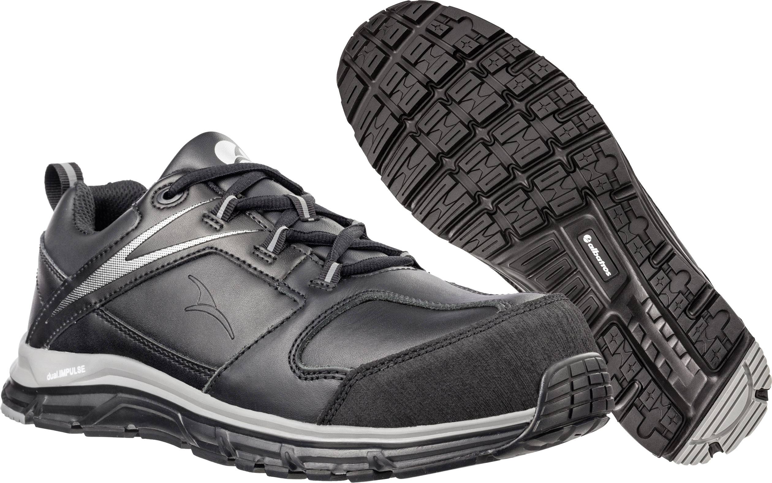 Black sports trainer with lace-up fastening and cushioned sole, shown from the side and underneath, suitable for outdoor activities.